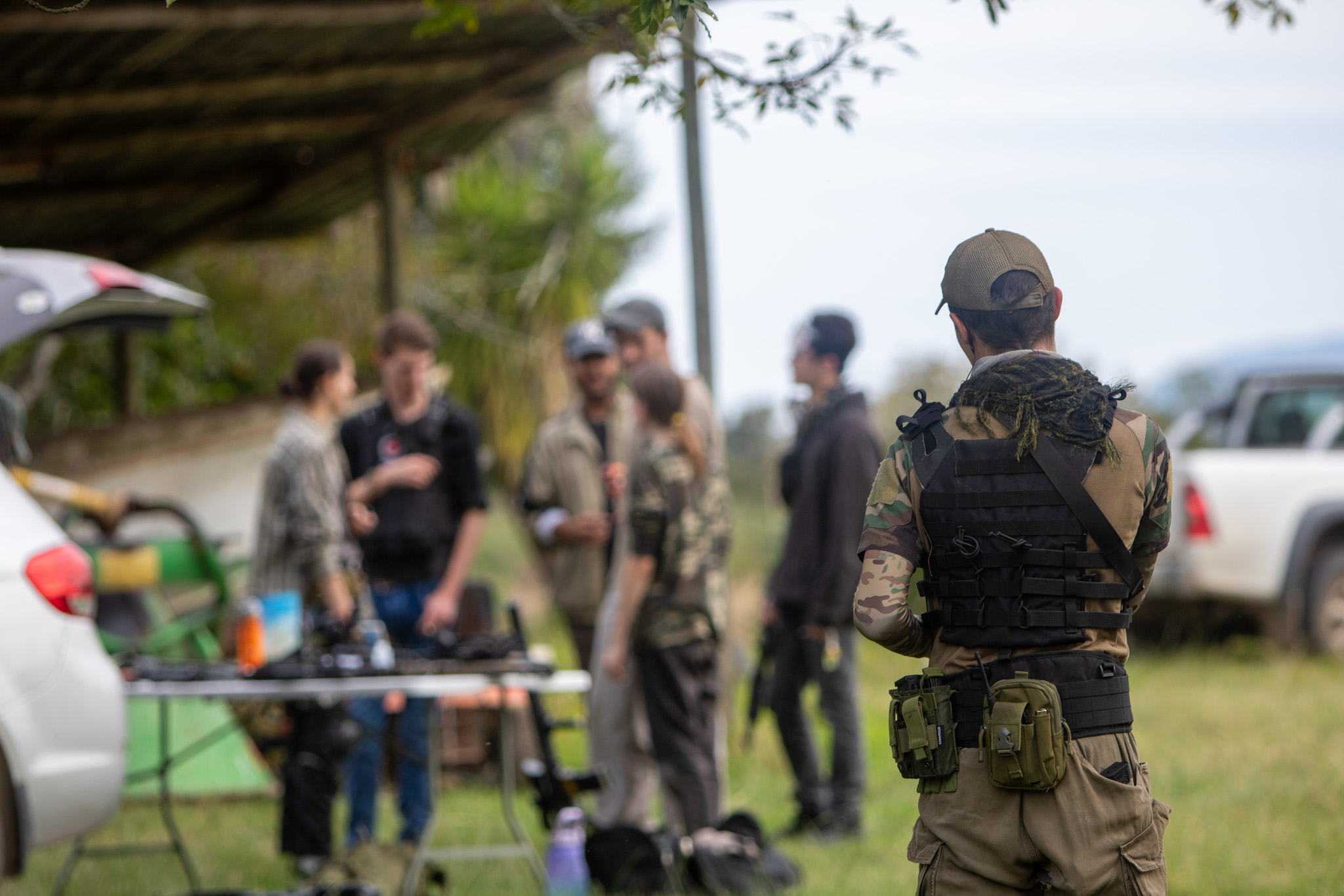 Airsoft players gathering for a field briefing